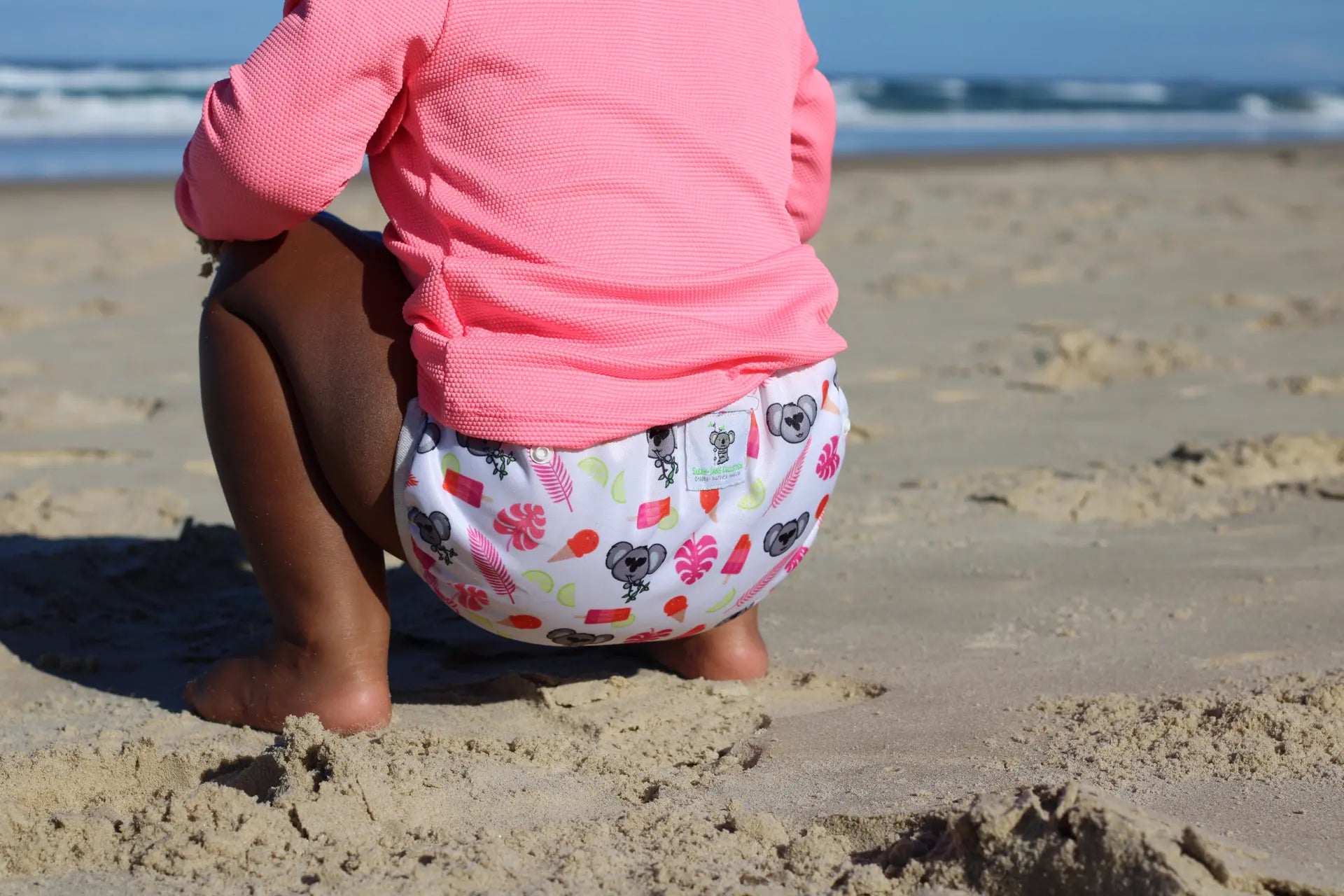 A toddler wearing a reusable swim nappy